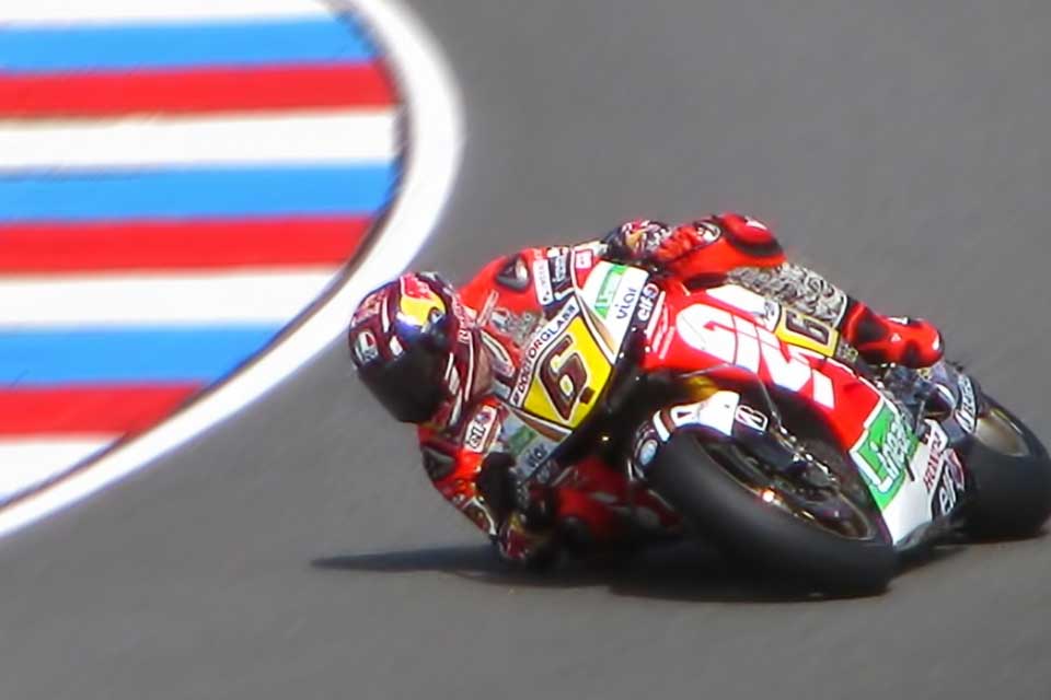 MotoGP racer leaning into a turn